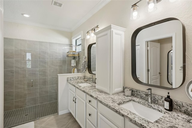 bathroom featuring vanity, tile patterned floors, an enclosed shower, and ornamental molding