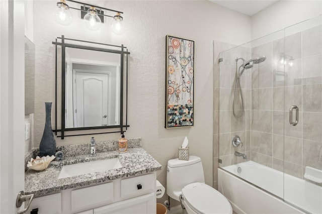 full bathroom featuring toilet, vanity, and combined bath / shower with glass door