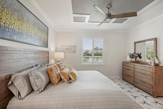 bedroom featuring multiple windows, ceiling fan, a textured ceiling, and ornamental molding