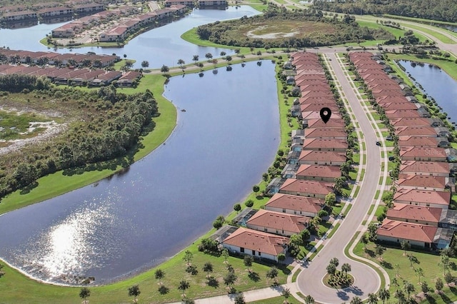 bird's eye view with a water view