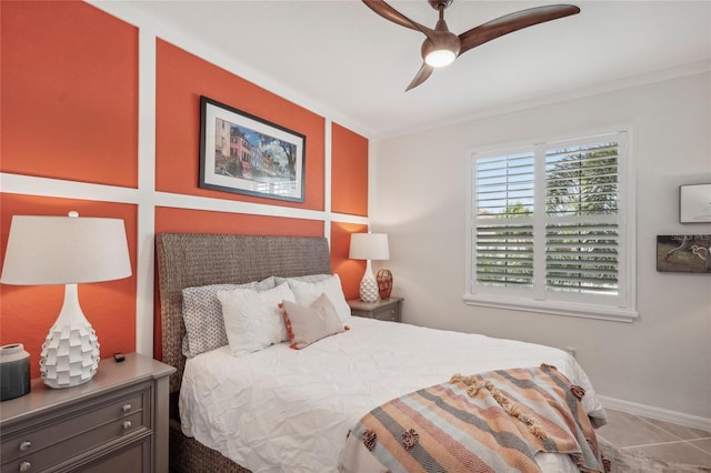 tiled bedroom featuring ceiling fan and ornamental molding