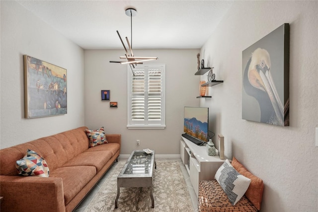 living room with a notable chandelier