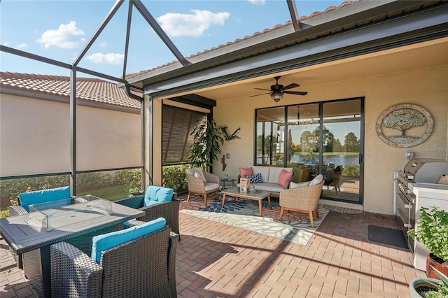 view of patio with an outdoor living space, ceiling fan, and a lanai