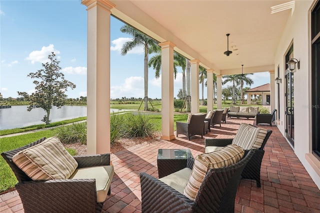 view of patio featuring a water view and an outdoor hangout area