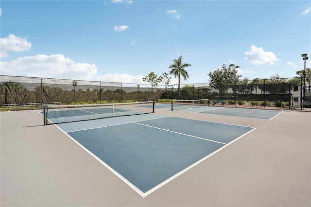 view of sport court with basketball hoop