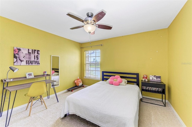 carpeted bedroom with baseboards and a ceiling fan