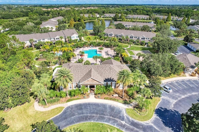 birds eye view of property with a residential view and a water view