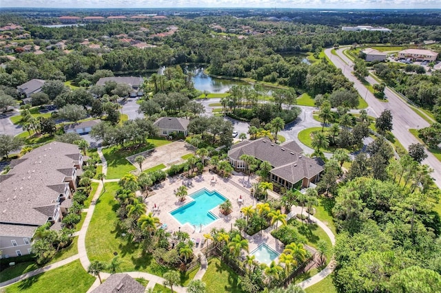 birds eye view of property with a water view