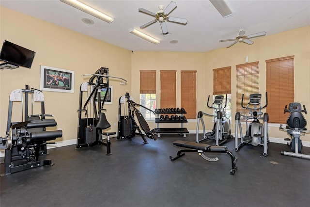 workout area with baseboards and a ceiling fan