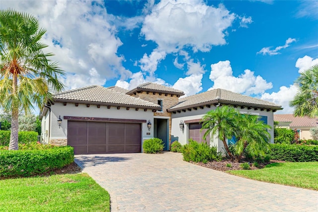 mediterranean / spanish-style home with a garage