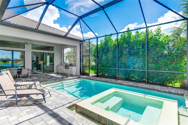 view of pool with ceiling fan, a patio, an in ground hot tub, and a lanai