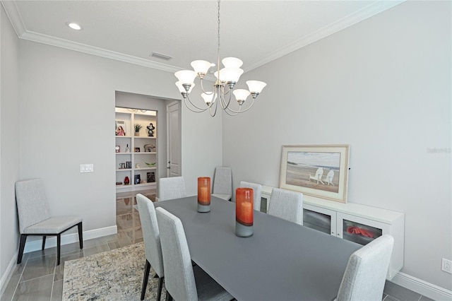 dining space with ornamental molding, a notable chandelier, and hardwood / wood-style flooring