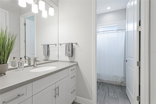 bathroom with vanity and a shower with shower curtain