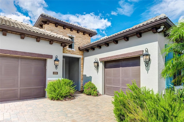 mediterranean / spanish house featuring a garage