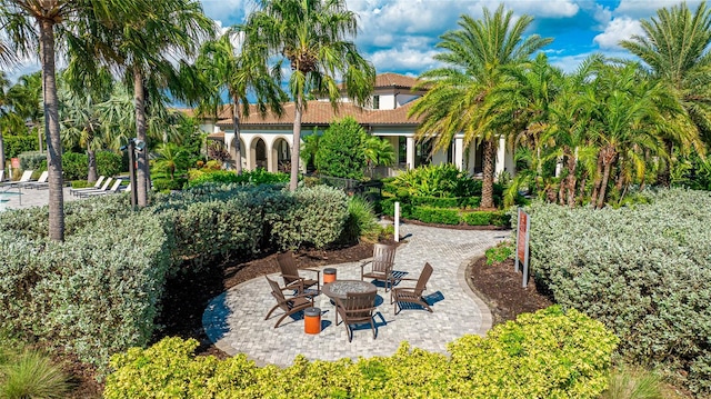 view of yard featuring a patio area and an outdoor fire pit