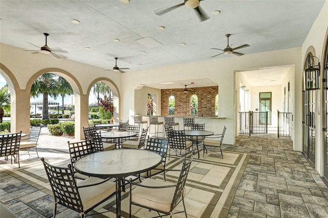 view of patio / terrace featuring ceiling fan