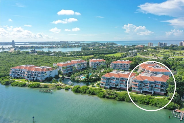 aerial view featuring a water view and a city view