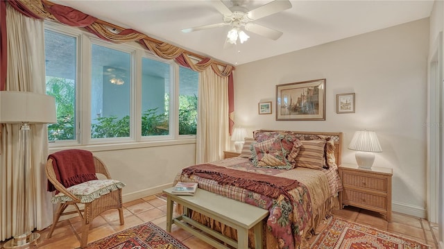 bedroom with ceiling fan and light tile patterned floors