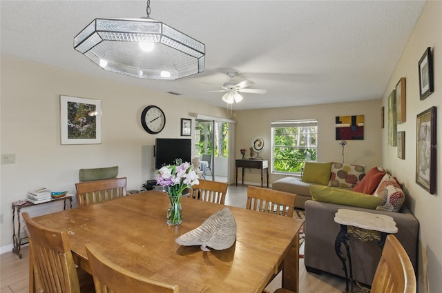 5071 Village Gardens Dr Unit 5, Sarasota, FL 34234 - dining space with a ceiling fan and baseboards