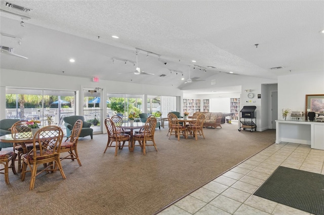 5071 Village Gardens Dr Unit 5, Sarasota, FL 34234 - dining room featuring vaulted ceiling, light colored carpet, light tile patterned flooring, a textured ceiling, and recessed lighting