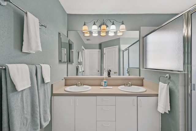 bathroom with an enclosed shower and vanity