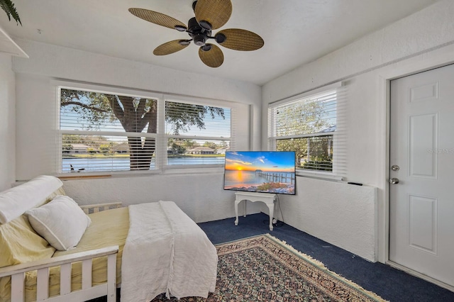 carpeted bedroom with ceiling fan