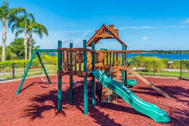 view of jungle gym featuring a water view