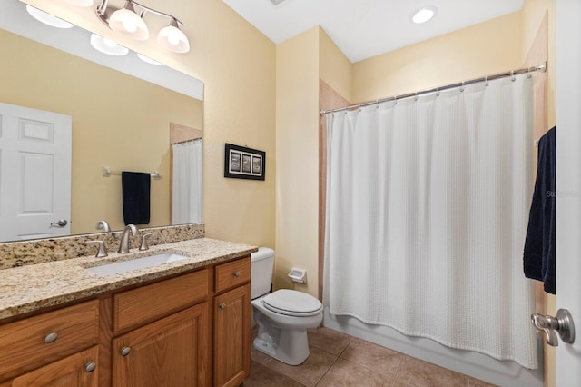 full bathroom featuring vanity, toilet, shower / bathtub combination with curtain, and tile patterned floors