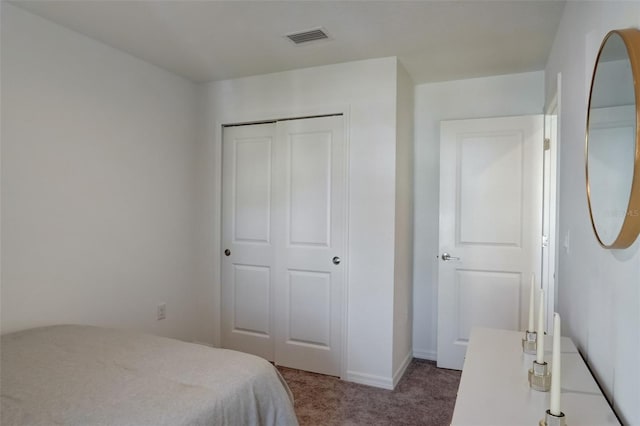 carpeted bedroom featuring a closet