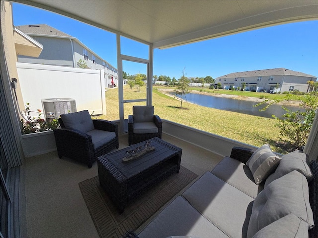 view of patio / terrace with a water view and an outdoor hangout area