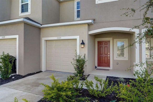 view of exterior entry featuring a garage