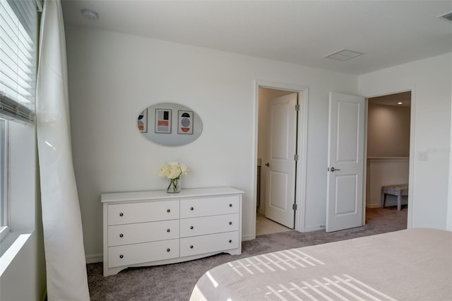 bedroom featuring light carpet