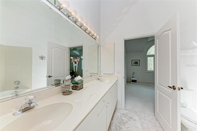 bathroom featuring vanity and a tub to relax in