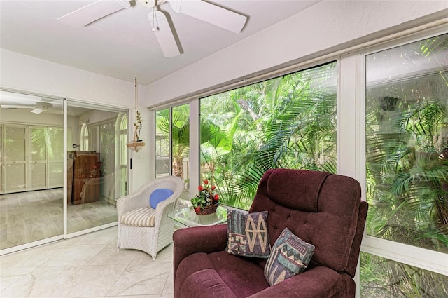 sunroom / solarium with ceiling fan