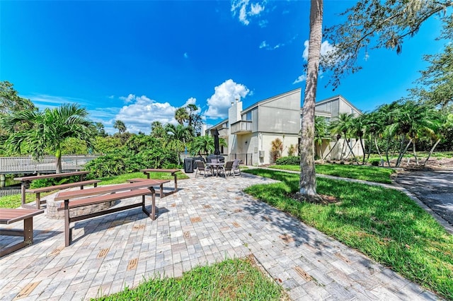 view of home's community featuring a patio area