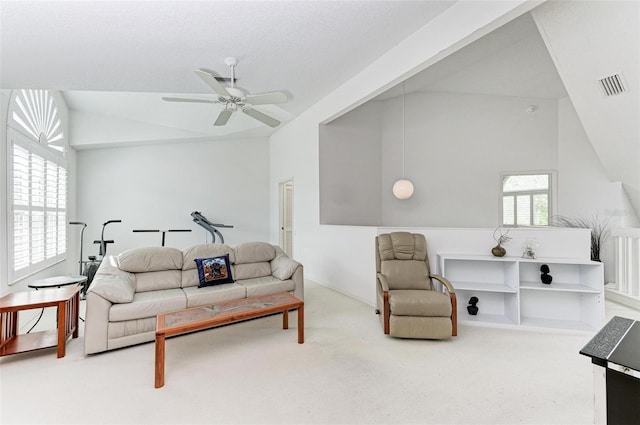 living room featuring carpet floors, ceiling fan, and lofted ceiling