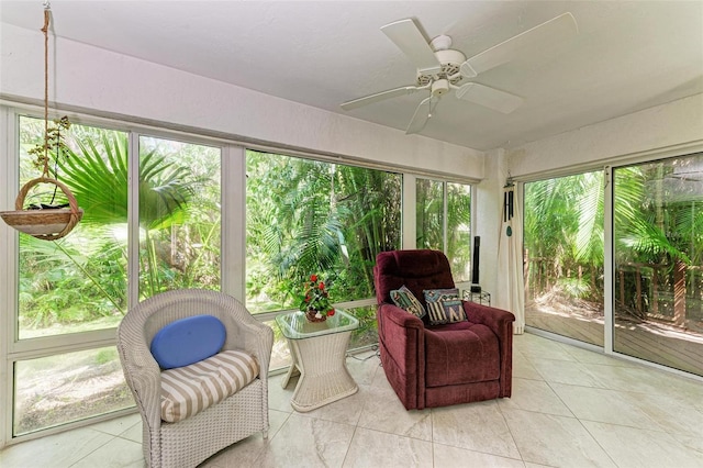 sunroom / solarium with ceiling fan and a healthy amount of sunlight