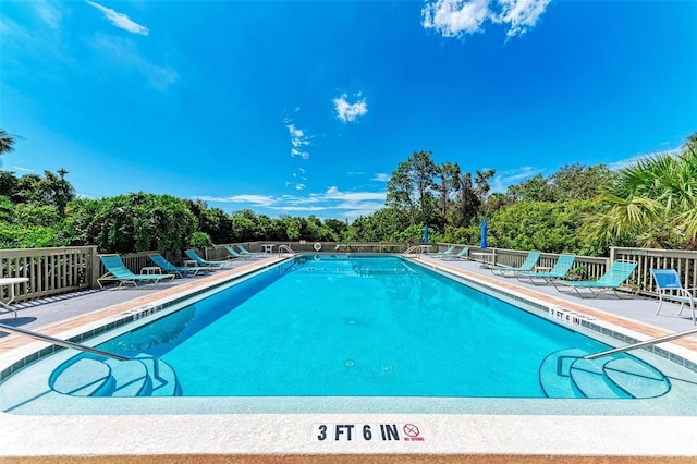 view of pool featuring a patio