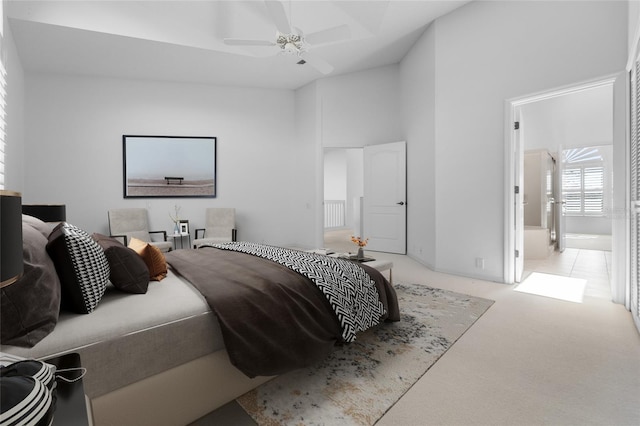 bedroom with carpet floors and a towering ceiling