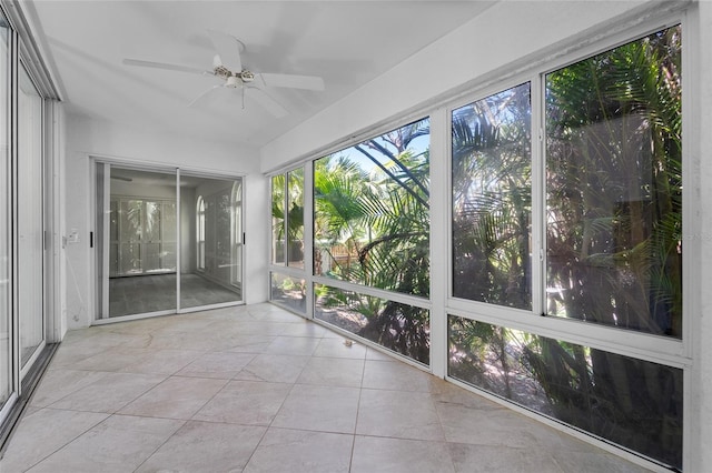 unfurnished sunroom with tile patterned floors