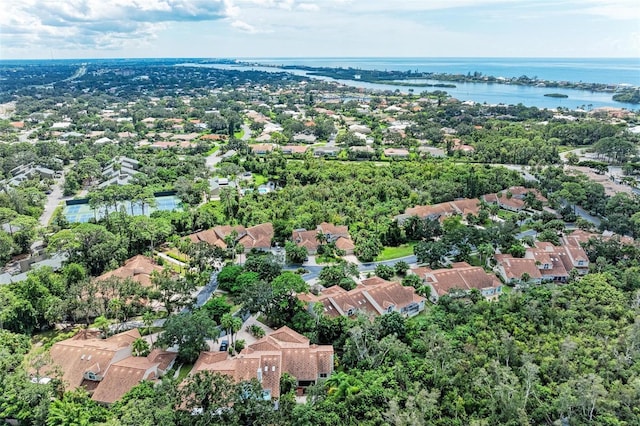 birds eye view of property with a residential view and a water view