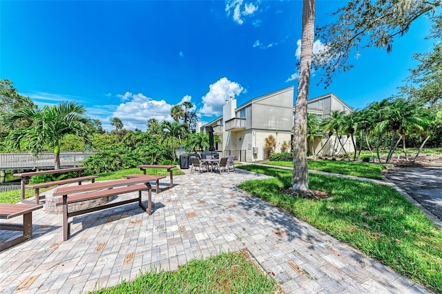 exterior space with fence and outdoor dining space