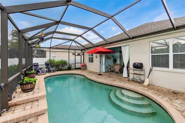 view of pool featuring a lanai and a patio area