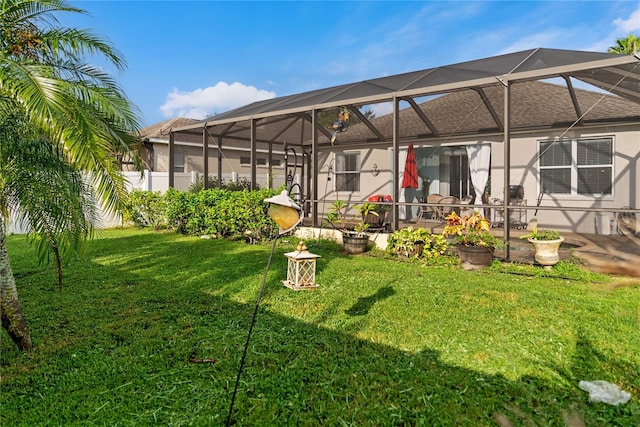 view of yard with a lanai and a patio area