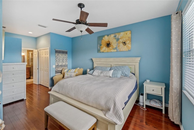 bedroom featuring ceiling fan and dark hardwood / wood-style floors