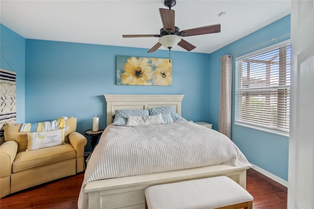 bedroom featuring ceiling fan and dark hardwood / wood-style floors