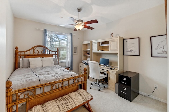 bedroom with ceiling fan and light colored carpet