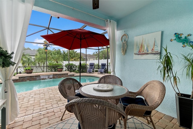 view of swimming pool featuring glass enclosure, a patio, and pool water feature