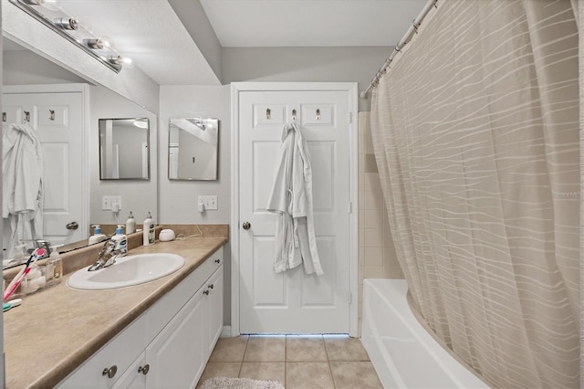 bathroom with shower / tub combo with curtain, vanity, and tile patterned floors