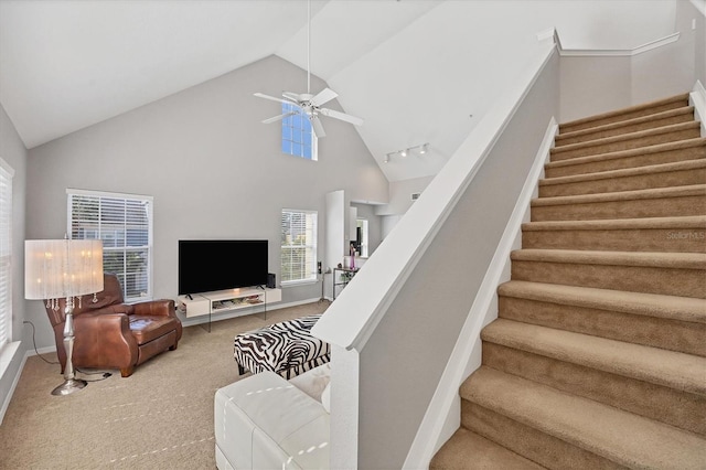 living room featuring ceiling fan, carpet, and high vaulted ceiling